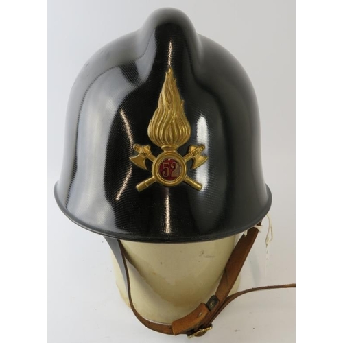 46 - A 1980s Italian Fire Service black carbonfibre fire helmet with brass badge