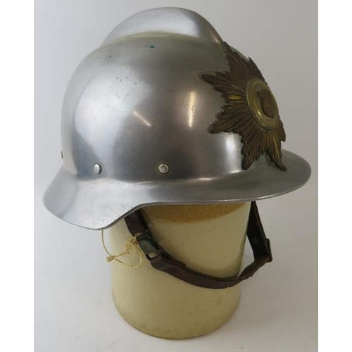 51 - A 1970s Danish Fire Service steel fire helmet with brass badge