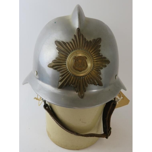 51 - A 1970s Danish Fire Service steel fire helmet with brass badge