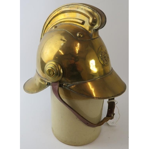 53 - An early 20th century brass Russian Fire Service fire helmet with partial liner.