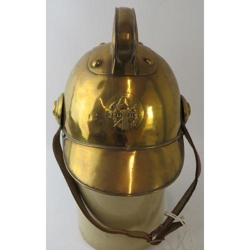 53 - An early 20th century brass Russian Fire Service fire helmet with partial liner.