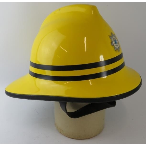 57 - A 1990s British Cromwell Firepro yellow fire helmet with Leeds Bradford Airport badge