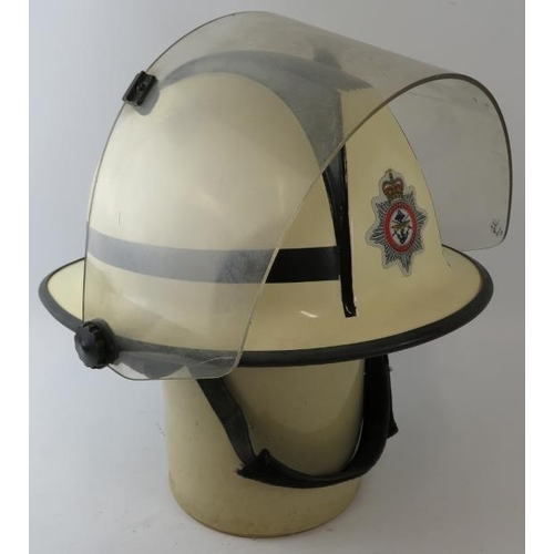 61 - A 1970s British white Cromwell F500s fire helmet with visor, badged Defence Fire Service