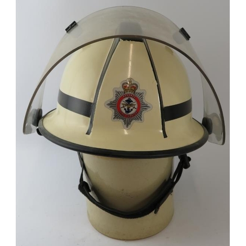 61 - A 1970s British white Cromwell F500s fire helmet with visor, badged Defence Fire Service