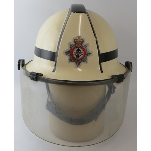 61 - A 1970s British white Cromwell F500s fire helmet with visor, badged Defence Fire Service