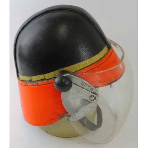 62 - A 1964 British Airports Authority Fire Service Hendry fire helmet with visor