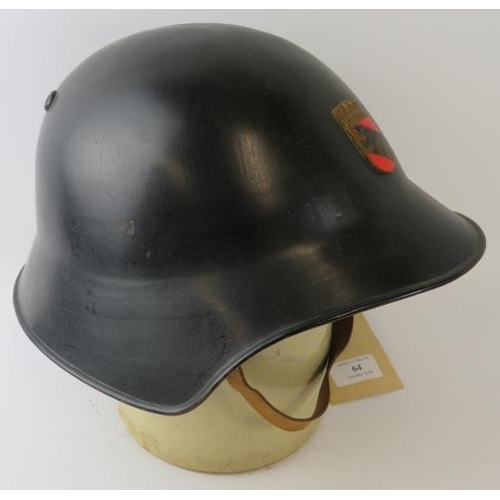 64 - A 1970s Swiss Bern Fire Service black steel fire helmet