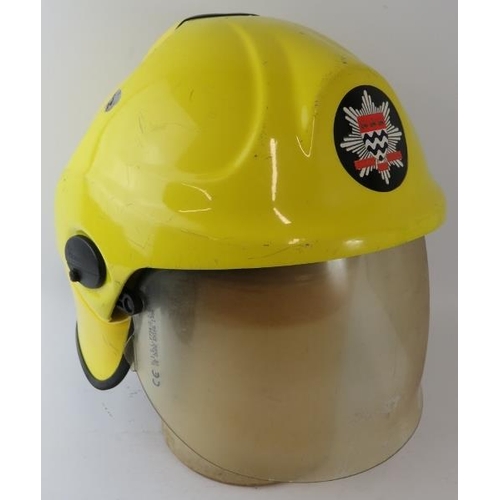 66 - A 2010 British London Fire Brigade Cromwell integrated system fire helmet