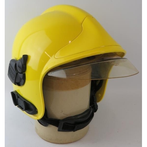 83 - A modern MSA Gallet ABS fire helmet with reflective integrated visor system