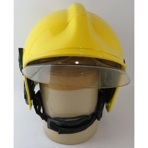 83 - A modern MSA Gallet ABS fire helmet with reflective integrated visor system