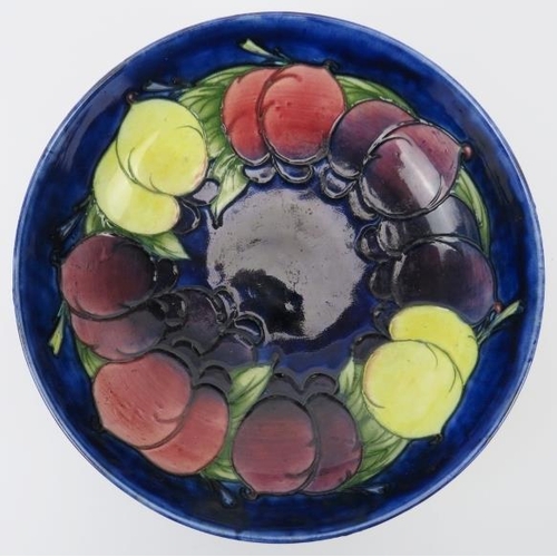 10 - A William Moorcroft ‘Wisteria’ pattern bowl, circa 1920s. Signed ‘W Moorcroft’ in blue with impresse... 