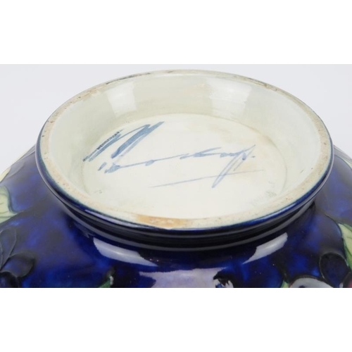 10 - A William Moorcroft ‘Wisteria’ pattern bowl, circa 1920s. Signed ‘W Moorcroft’ in blue with impresse... 