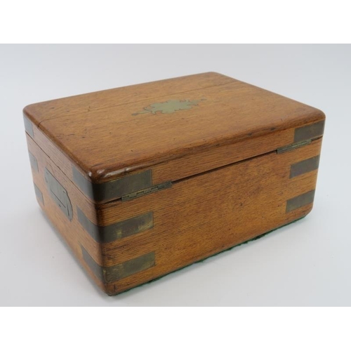 102 - A Victorian brass bound oak letter or jewellery box. With an internal tray, the corners reinforced w... 