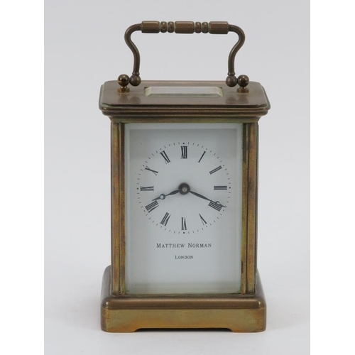 104 - A brass carriage clock by Matthew Norman of London. 12 cm height. Condition report: Some age related... 