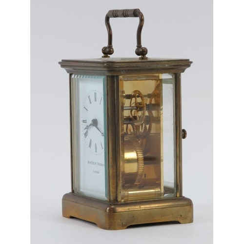 104 - A brass carriage clock by Matthew Norman of London. 12 cm height. Condition report: Some age related... 