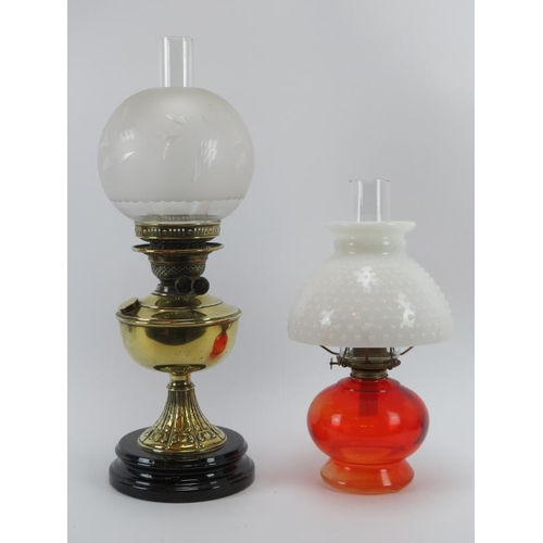 120 - A late Victorian brass oil lamp and American glass oil lamp, late 19th/early 20th century. (2 items)... 