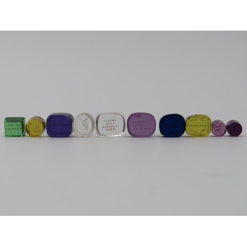 126 - A group of ten coloured and clear engraved glass intaglio seals. (10 items) 1.9 cm largest width. Co... 