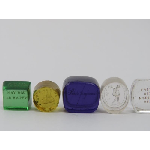 126 - A group of ten coloured and clear engraved glass intaglio seals. (10 items) 1.9 cm largest width. Co... 