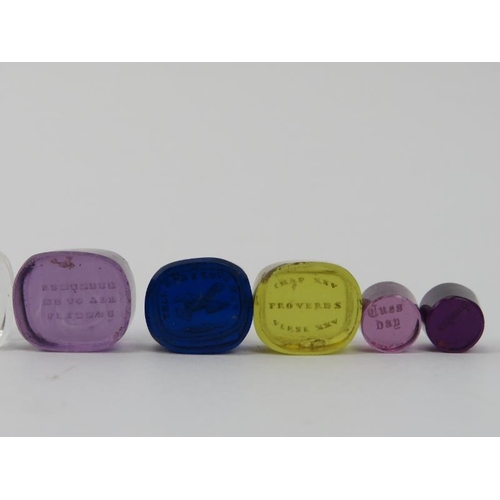 126 - A group of ten coloured and clear engraved glass intaglio seals. (10 items) 1.9 cm largest width. Co... 