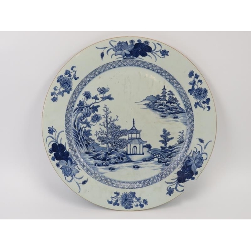 131 - A large Chinese blue and white porcelain charger, 18th century. 40.8 cm diameter. Condition report: ... 