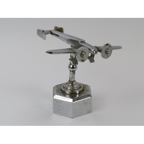 135 - A WWII chromed metal desktop sweetheart model of an RAF bomber. Inscribed ‘Made by T H Overl R.A.O.C... 