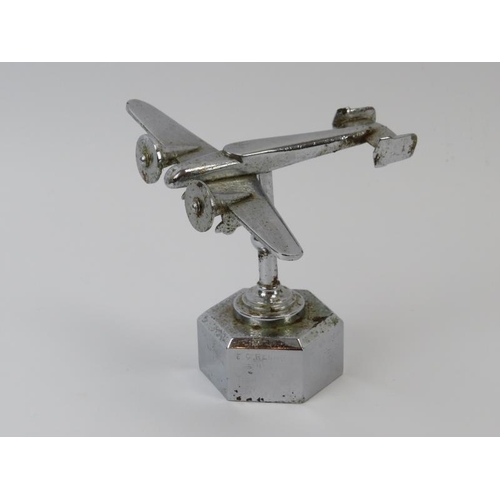 135 - A WWII chromed metal desktop sweetheart model of an RAF bomber. Inscribed ‘Made by T H Overl R.A.O.C... 