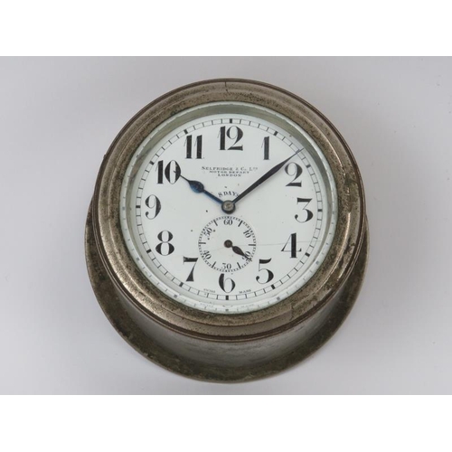 137 - A Selfridge & Co Motor Depart[ment] 8 Day car dashboard clock dial. With a plated brass and bevelled... 