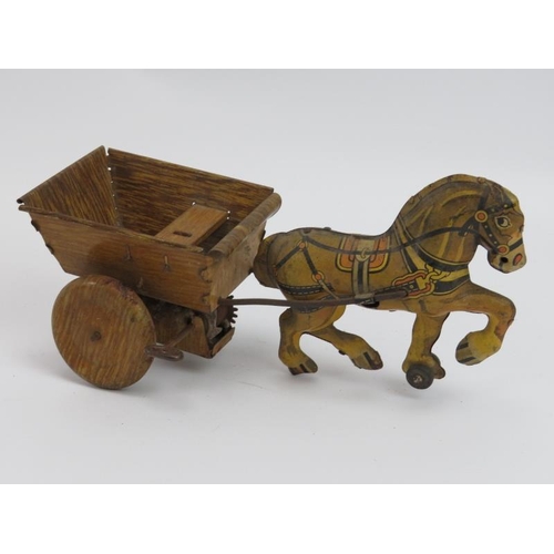 138 - A group of vintage collectable items. Comprising two British tin toys (Tractor and horse pulling car... 