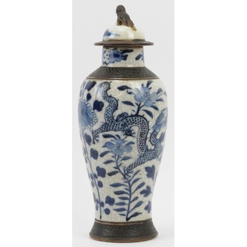 14 - A Chinese blue and white sgraffito decorated crackled glazed porcelain vase and cover, 19th century.... 