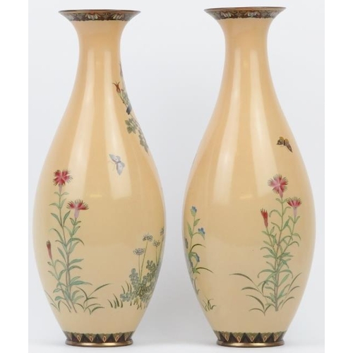 15 - A pair of Japanese cloisonné enamelled vases, late Meiji period. Decorated with birds amongst flower... 