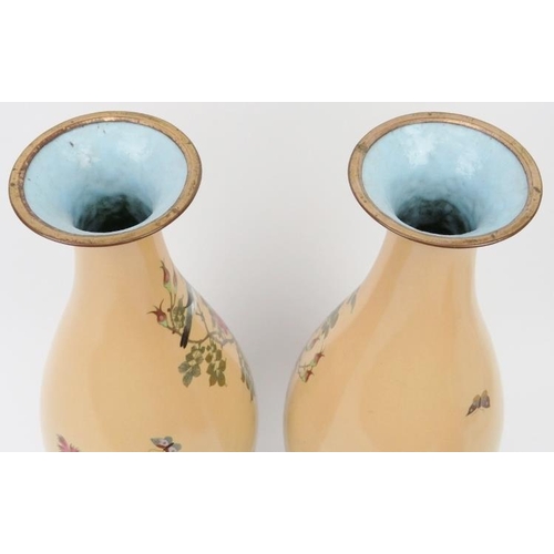 15 - A pair of Japanese cloisonné enamelled vases, late Meiji period. Decorated with birds amongst flower... 