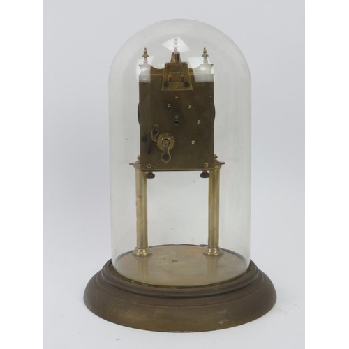 150 - A brass torsion pendulum clock with glass dome, early 20th century. 28 cm total height. 
Condition r... 