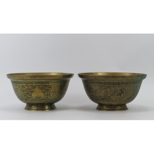 151 - A large pair of Chinese brass engraved bowls, 20th century. Decorated with dragons and phoenixes. (2... 