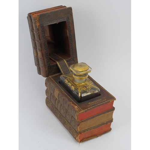 187 - A novelty antique gilt tooled leather book decanter case. The 19th century books combined and adapte... 