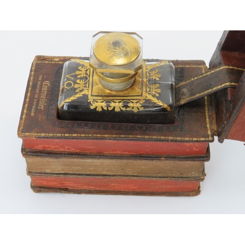 187 - A novelty antique gilt tooled leather book decanter case. The 19th century books combined and adapte... 