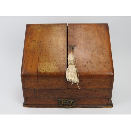 226 - A Victorian mahogany desk top cabinet. The sloped double doors open to reveal a letter rack, perpetu... 