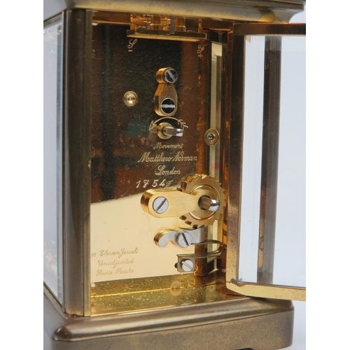 233 - An English eleven jewels brass carriage clock by Matthew Norman of London, 20th century. Key include... 