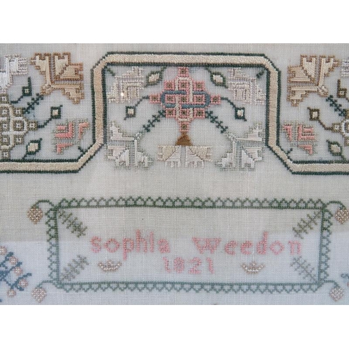 238 - A George IV period needlework sampler, dated 1821. Framed and glazed. 43 cm x 34 cm. Condition repor... 