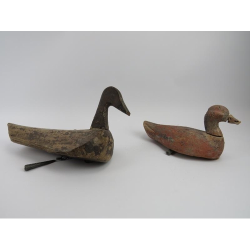 250 - Two antique decoy carved ducks. Both with suspended lead weights. 37 cm length, 28.5 cm length. (2 i... 