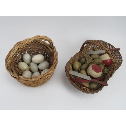 253 - Two wicker baskets containing antique and modern dummy birds and hens eggs. Two carved and painted w... 