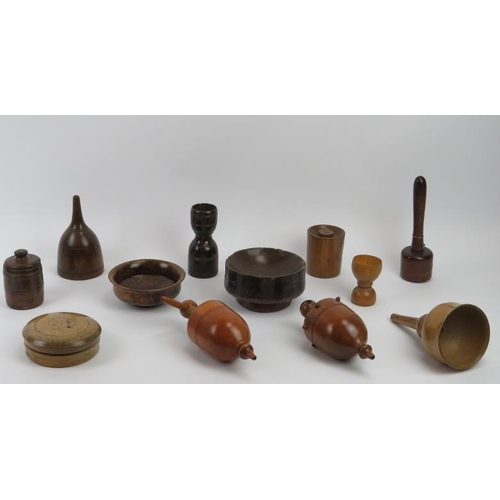 255 - Treen / Kitchenalia: A group of turned and carved wood kitchen objects, 18th - 20th century.  Items ... 