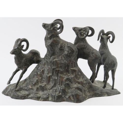 29 - A large bronze figural group of rams depicted on rocky outcrop, late 19th/early 20th century. 36 cm ... 