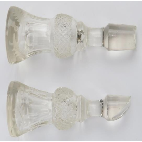 32 - A pair of late Victorian cut and engraved crystal glass drinks decanters. Both of inverted thistle f... 