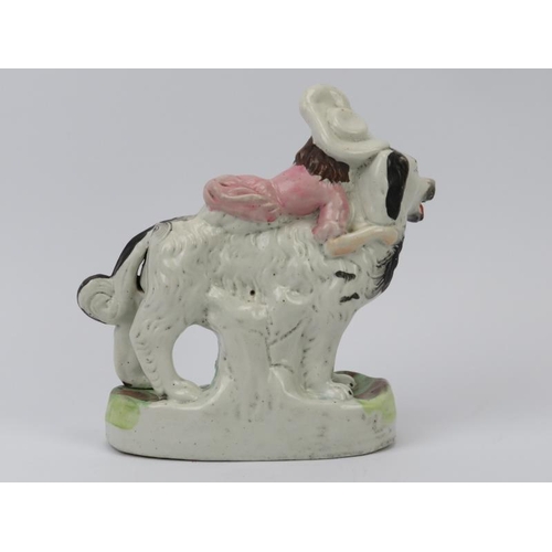 49 - A rare Staffordshire porcelain figural group depicting a girl riding a spaniel dog, mid 19th century... 