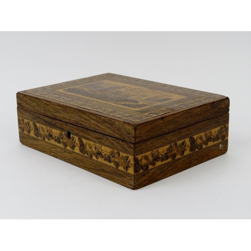 53 - A Tunbridge ware box depicting Hever Castle to the hinged cover. 20.3 cm length. Condition report: S... 