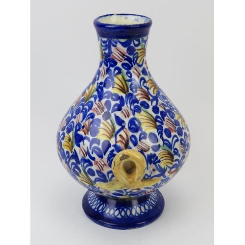 56 - A Moroccan twin handled foliate decorated ceramic vase. 27 cm height. Co9ndition report: Some age re... 