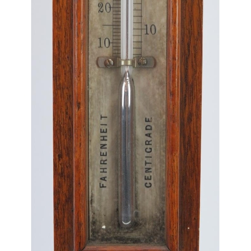 59 - A Victorian mahogany cased barometer and thermometer. Inscribed ‘J Casartelli 43 Market St Mancheste... 