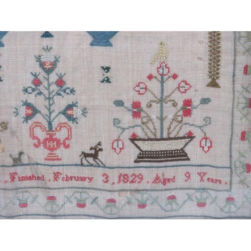 60 - A George IV period embroidered needlework sampler, dated 1927. Framed and glazed. 43 cm x 31 cm. Con... 