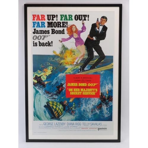 79 - A James Bond 007 ‘On Her Majesty’s Secret Service’ film poster. Later reproduction. Framed and glaze... 