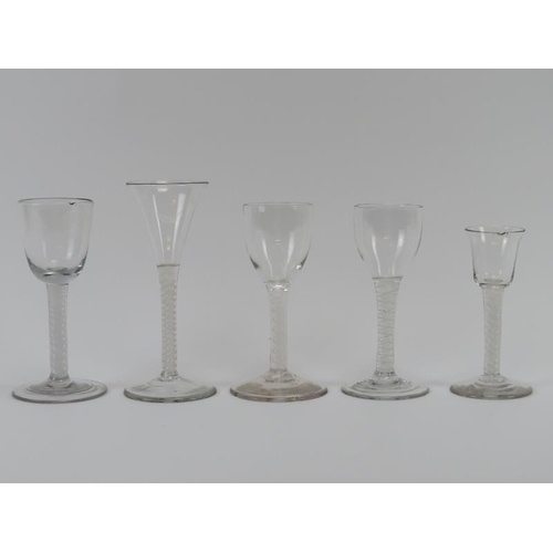 84 - Five Georgian period English drinking glasses, 18th century. With an opaque spiral twist stems. (5 i... 